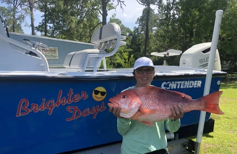 Angler holding a 27-inch fish in Pensacola