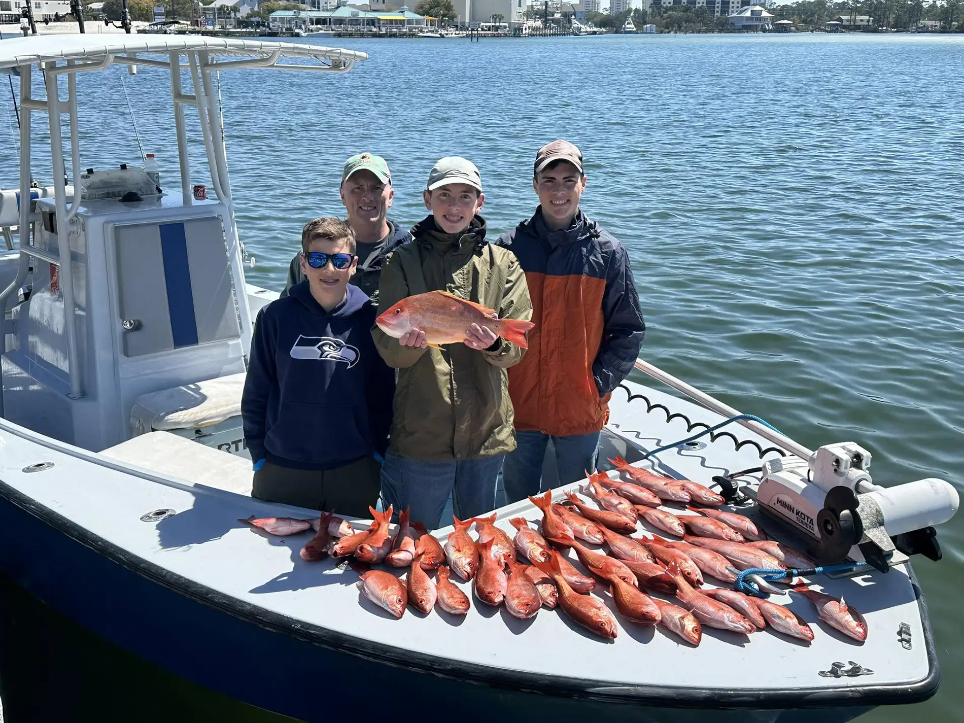 Angler reeling in a catch on a charter trip